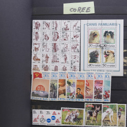 Vrac philatélique de timbres du monde neufs et oblitérés en un carton.