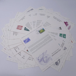 Vrac philatélique de timbres du monde neufs et oblitérés en un carton.