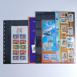 Vrac philatélique de timbres du monde neufs et oblitérés en un carton.