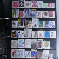 Lot massif de timbres d'Europe neufs et oblitérés en 4 albums.