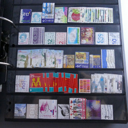 Lot massif de timbres d'Europe neufs et oblitérés en 4 albums.