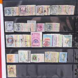 Lot massif de timbres d'Asie - Moyen Orient neufs et oblitérés en un album.