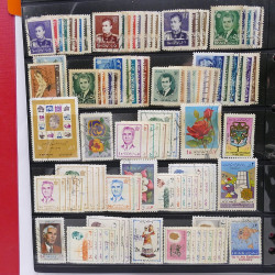 Lot massif de timbres d'Asie - Moyen Orient neufs et oblitérés en un album.