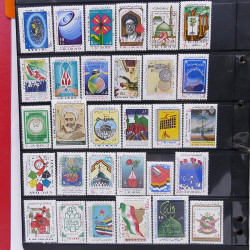Lot massif de timbres d'Asie - Moyen Orient neufs et oblitérés en un album.