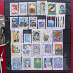 Lot massif de timbres d'Asie - Moyen Orient neufs et oblitérés en un album.