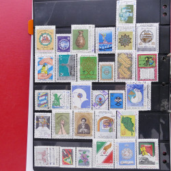 Lot massif de timbres d'Asie - Moyen Orient neufs et oblitérés en un album.
