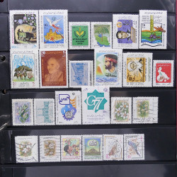 Lot massif de timbres d'Asie - Moyen Orient neufs et oblitérés en un album.