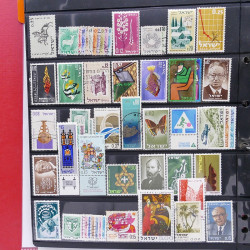 Lot massif de timbres d'Asie - Moyen Orient neufs et oblitérés en un album.