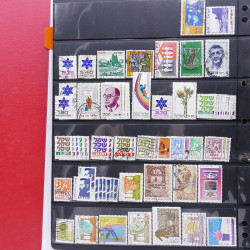 Lot massif de timbres d'Asie - Moyen Orient neufs et oblitérés en un album.