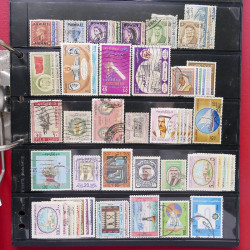 Lot massif de timbres d'Asie - Moyen Orient neufs et oblitérés en un album.