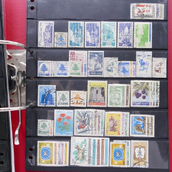 Lot massif de timbres d'Asie - Moyen Orient neufs et oblitérés en un album.