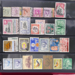 Lot massif de timbres d'Asie - Moyen Orient neufs et oblitérés en un album.
