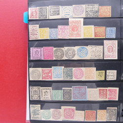 Lot massif de timbres d'Asie - Moyen Orient neufs et oblitérés en un album.