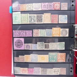 Lot massif de timbres d'Asie - Moyen Orient neufs et oblitérés en un album.