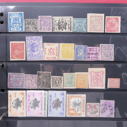 Lot massif de timbres d'Asie - Moyen Orient neufs et oblitérés en un album.