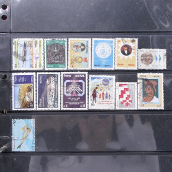 Lot massif de timbres d'Asie - Moyen Orient neufs et oblitérés en un album.