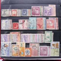 Lot massif de timbres d'Asie - Moyen Orient neufs et oblitérés en un album.
