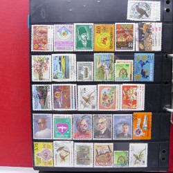 Lot massif de timbres d'Asie - Moyen Orient neufs et oblitérés en un album.