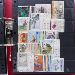 Lot massif de timbres d'Asie - Moyen Orient neufs et oblitérés en un album.