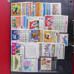 Lot massif de timbres d'Asie - Moyen Orient neufs et oblitérés en un album.