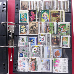 Lot massif de timbres d'Asie - Moyen Orient neufs et oblitérés en un album.