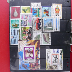 Lot massif de timbres d'Asie - Moyen Orient neufs et oblitérés en un album.