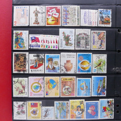 Lot massif de timbres d'Asie - Moyen Orient neufs et oblitérés en un album.