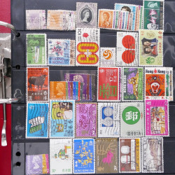 Lot massif de timbres d'Asie - Moyen Orient neufs et oblitérés en un album.