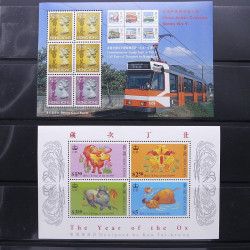 Lot massif de timbres d'Asie - Moyen Orient neufs et oblitérés en un album.