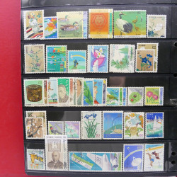 Lot massif de timbres d'Asie - Moyen Orient neufs et oblitérés en un album.