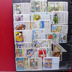 Lot massif de timbres d'Asie - Moyen Orient neufs et oblitérés en un album.