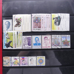 Lot massif de timbres d'Asie - Moyen Orient neufs et oblitérés en un album.