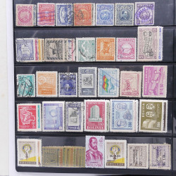 Lot massif de timbres d'Amérique du sud et centrale neufs et oblitérés en un album.