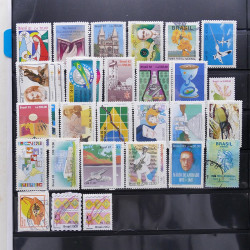 Lot massif de timbres d'Amérique du sud et centrale neufs et oblitérés en un album.