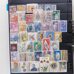 Lot massif de timbres d'Amérique du sud et centrale neufs et oblitérés en un album.