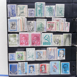 Lot massif de timbres d'Amérique du sud et centrale neufs et oblitérés en un album.