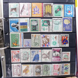 Lot massif de timbres d'Amérique du sud et centrale neufs et oblitérés en un album.