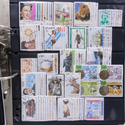 Lot massif de timbres d'Amérique du sud et centrale neufs et oblitérés en un album.