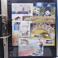 Lot massif de timbres d'Amérique du sud et centrale neufs et oblitérés en un album.