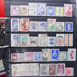 Lot massif de timbres d'Amérique et Afrique neufs et oblitérés en album.