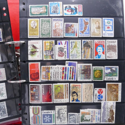 Lot massif de timbres d'Amérique et Afrique neufs et oblitérés en album.