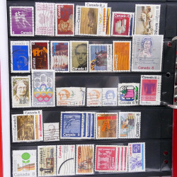 Lot massif de timbres d'Amérique et Afrique neufs et oblitérés en album.