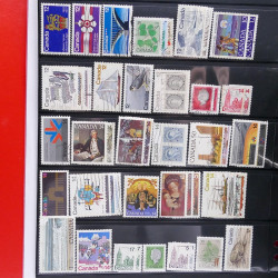 Lot massif de timbres d'Amérique et Afrique neufs et oblitérés en album.