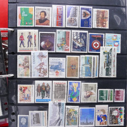 Lot massif de timbres d'Amérique et Afrique neufs et oblitérés en album.