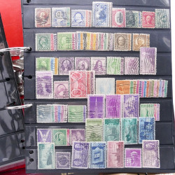 Lot massif de timbres d'Amérique et Afrique neufs et oblitérés en album.
