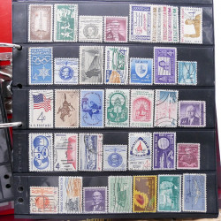 Lot massif de timbres d'Amérique et Afrique neufs et oblitérés en album.