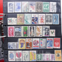 Lot massif de timbres d'Amérique et Afrique neufs et oblitérés en album.