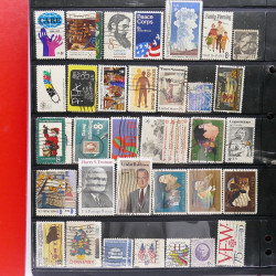 Lot massif de timbres d'Amérique et Afrique neufs et oblitérés en album.