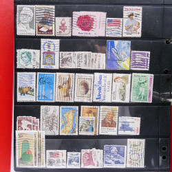 Lot massif de timbres d'Amérique et Afrique neufs et oblitérés en album.