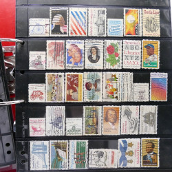 Lot massif de timbres d'Amérique et Afrique neufs et oblitérés en album.